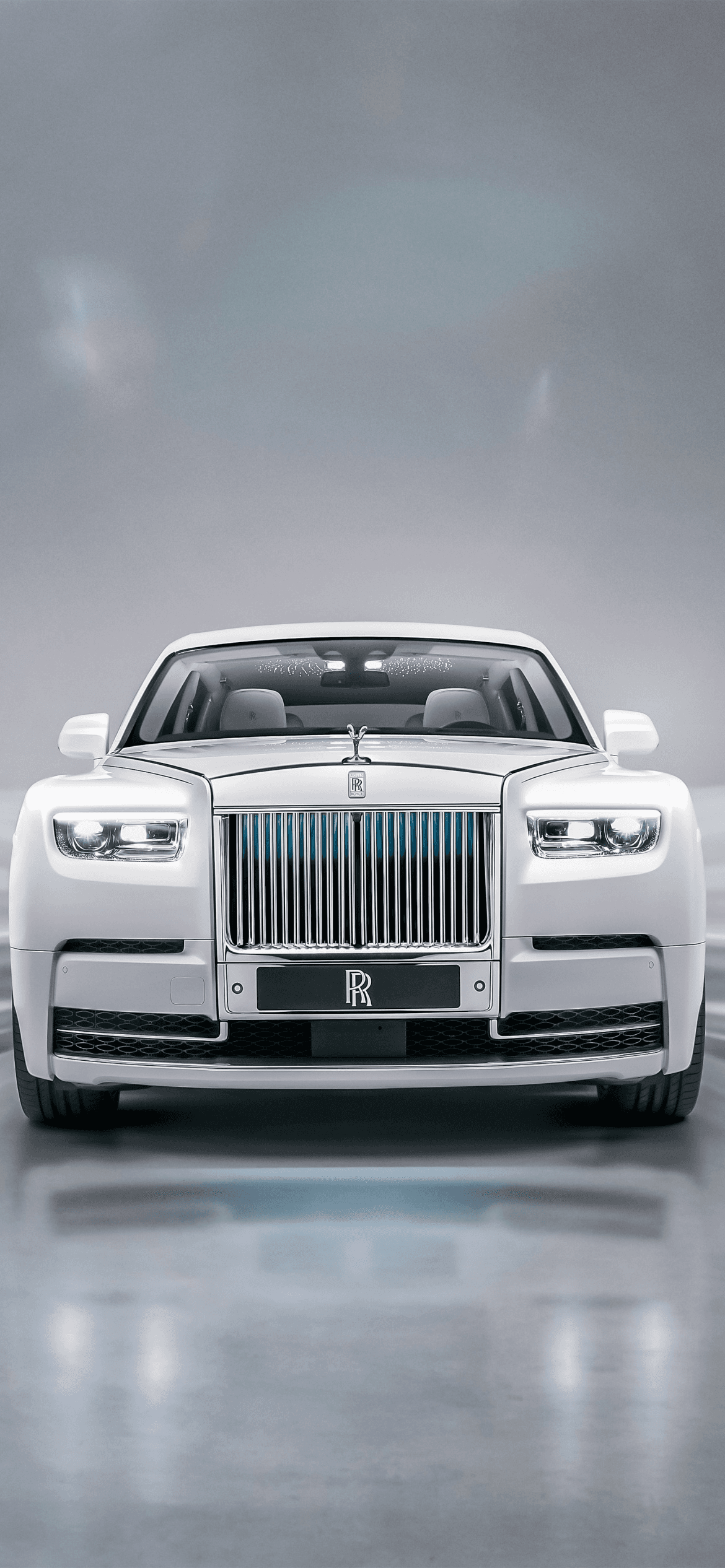 Front view of a white Rolls-Royce in a studio
